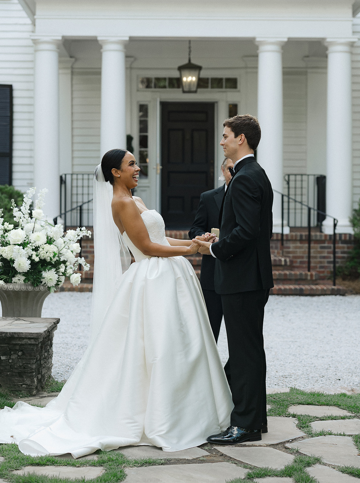 Bride and groom laughing during their outdoor ceremony at Primrose Cottage in Roswell, Georgia, captured by Atlanta documentary wedding photographer Kate Hensley Phillips. The moment highlights joy, emotion, and connection in a classic Southern setting.