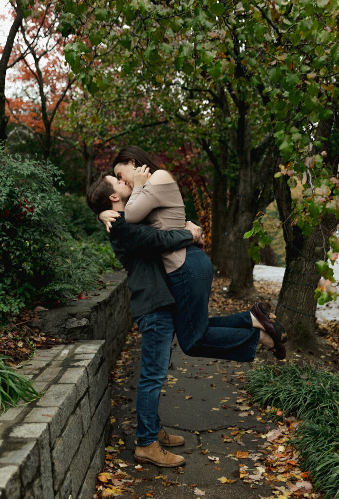 Collin picking up Peyton during their Virginia Highlands engagement session