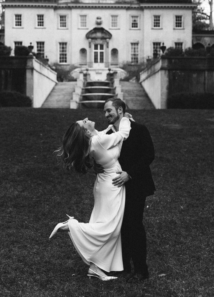 Playful moment between Victoria and Ross on the Swan House lawn in Atlanta